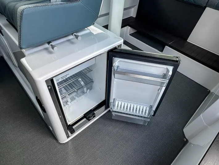  Yacht Photos Pics 2024 Axopar 37XC CROSS CABIN interior with open mini fridge.