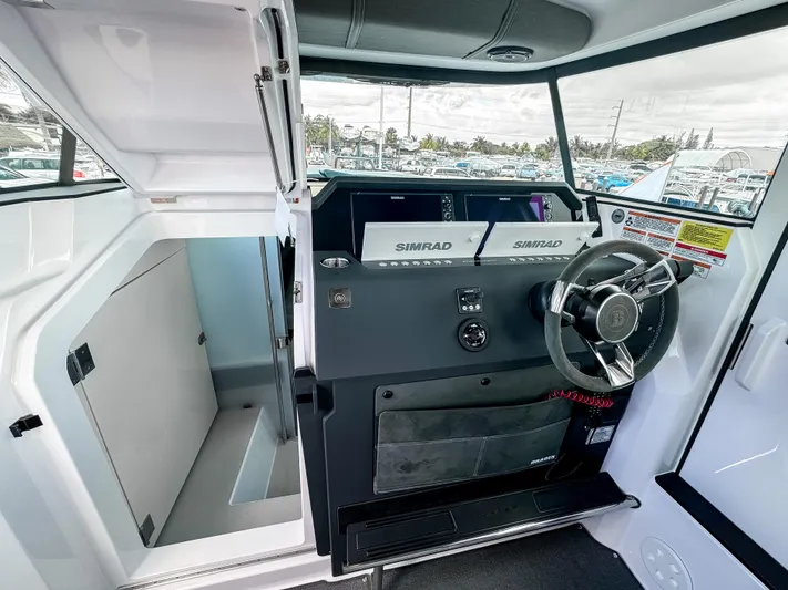  Yacht Photos Pics 2024 Axopar 37XC CROSS CABIN helm with Simrad electronics and modern steering wheel.