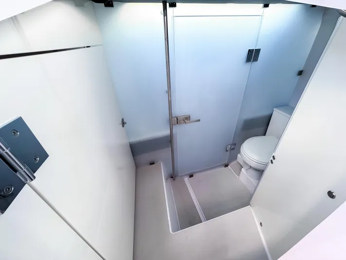  Yacht Photos Pics 2024 Axopar 37XC CROSS CABIN bathroom interior with modern fixtures and sleek design.