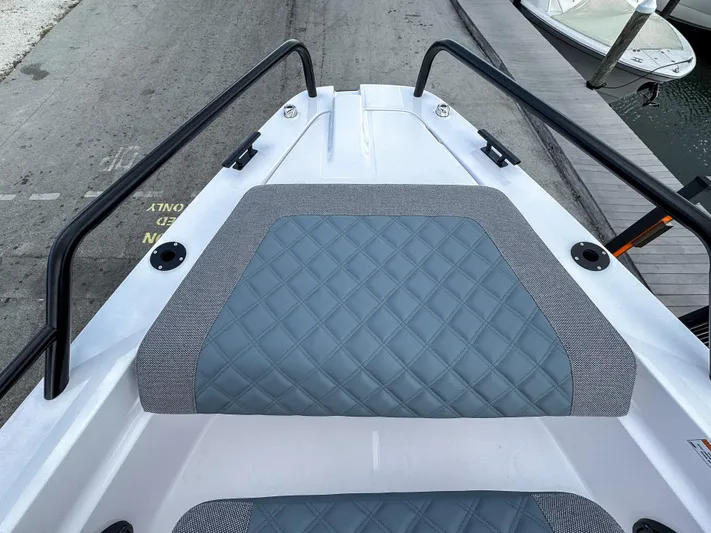  Yacht Photos Pics 2024 Axopar 37XC CROSS CABIN bow with quilted seating and sleek railings.