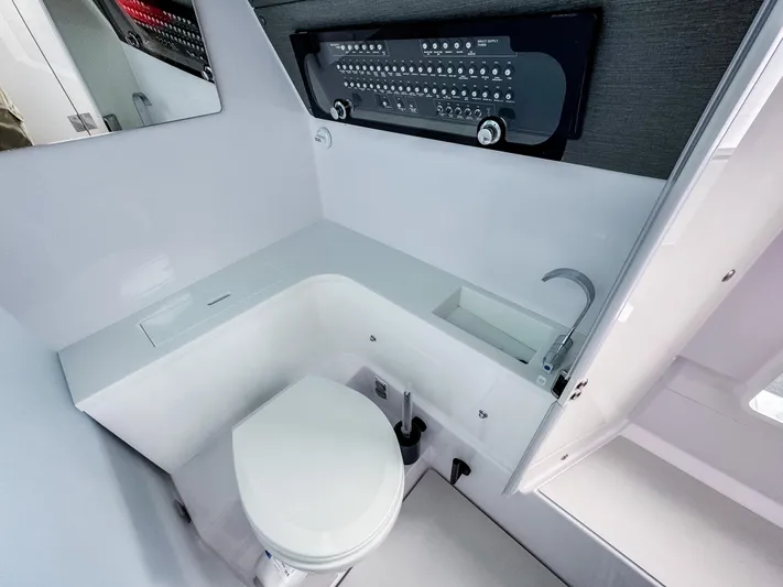  Yacht Photos Pics 2024 Axopar 37XC CROSS CABIN bathroom with modern fixtures and sleek design.