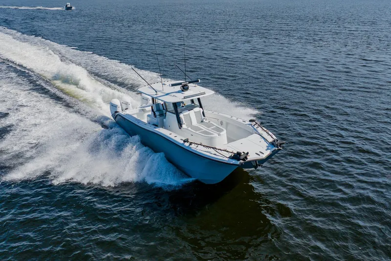  Yacht Photos Pics 2024 Costa Custom Boats 34SV cruising on open water, showcasing sleek design and performance.