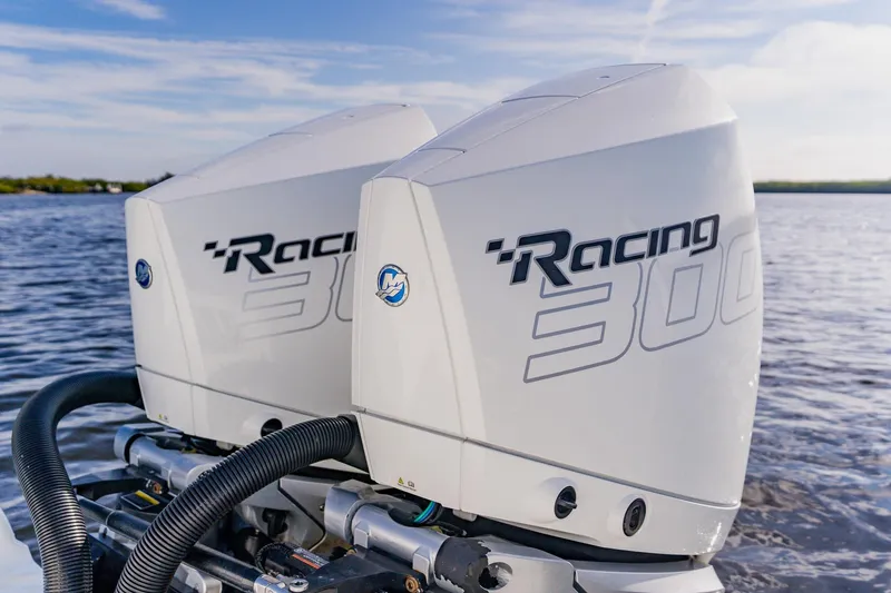  Yacht Photos Pics Twin Mercury Racing 300 outboard engines on 2024 Costa Custom Boats 34SV, cruising on open water.