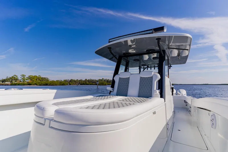  Yacht Photos Pics 2024 Costa Custom Boats 34SV on water, showcasing sleek design and luxury seating.