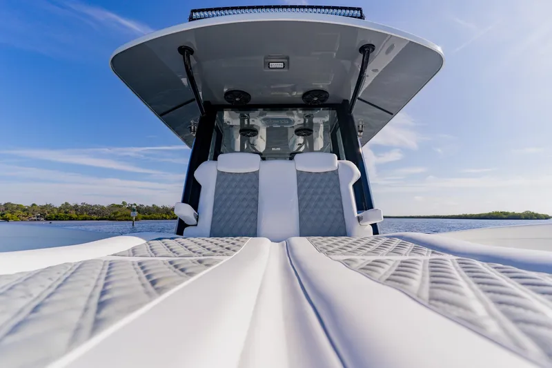  Yacht Photos Pics 2024 Costa Custom Boats 34SV, luxury seating, sleek design, on calm water.