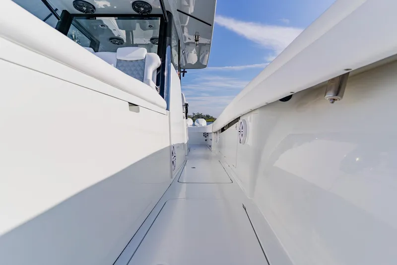  Yacht Photos Pics 2024 Costa Custom Boats 34SV, sleek white deck view under blue sky.