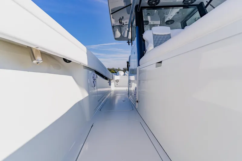  Yacht Photos Pics 2024 Costa Custom Boats 34SV, sleek white deck view under clear blue sky.