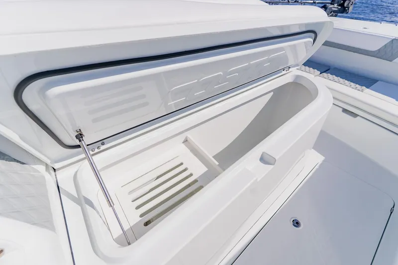  Yacht Photos Pics Open storage compartment on 2024 Costa Custom Boats 34SV, showcasing sleek design and functionality.