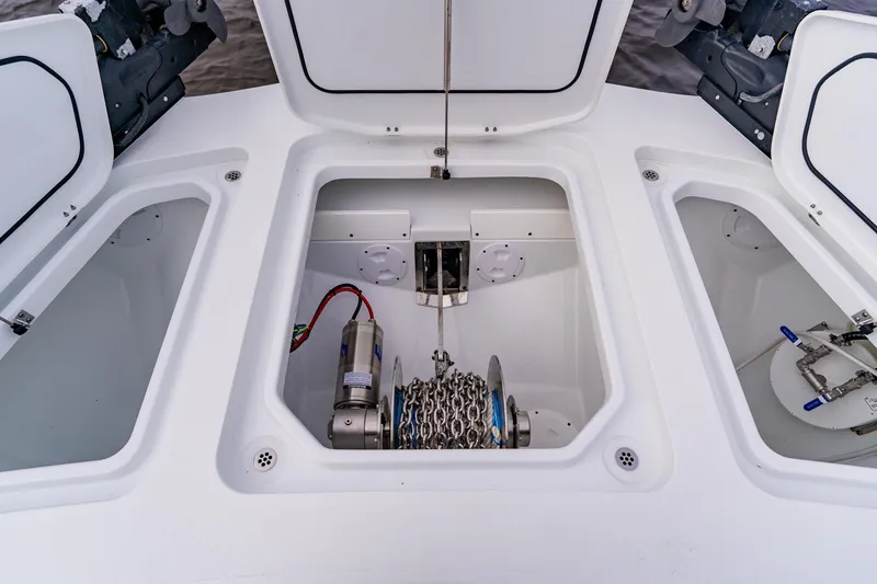  Yacht Photos Pics Anchor storage compartment on a 2024 Costa Custom Boats 34SV, featuring a winch and chain.