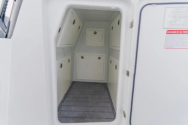  Yacht Photos Pics 2024 Costa Custom Boats 34SV interior storage compartment with multiple access panels.
