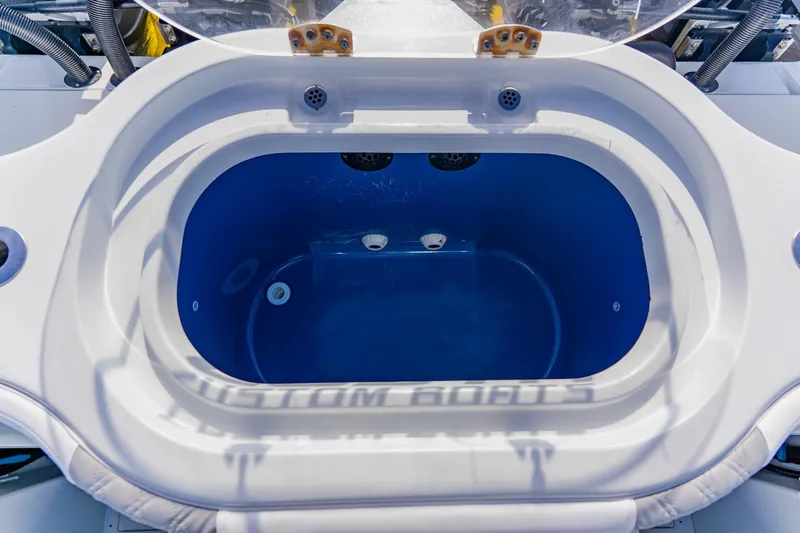  Yacht Photos Pics 2024 Costa Custom Boats 34SV livewell with blue interior and white exterior.