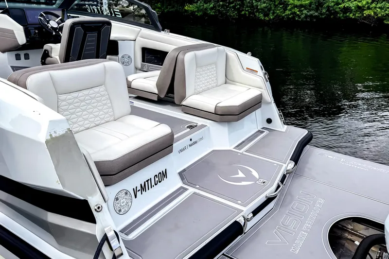  Yacht Photos Pics Luxury seating on 2026 Ingenity EL boat, featuring modern design and waterfront view.