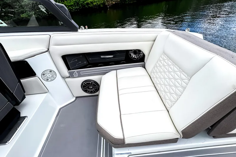  Yacht Photos Pics Luxurious seating on 2026 Ingenity EL boat with quilted upholstery and integrated speakers.