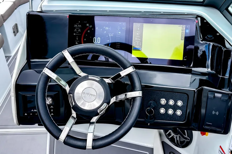  Yacht Photos Pics Steering wheel and dashboard of 2026 Ingenity EL boat with digital displays.