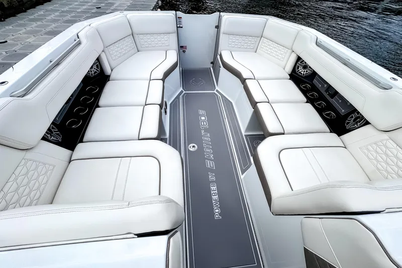  Yacht Photos Pics Luxurious seating on 2026 Ingenity EL boat, featuring elegant white upholstery and modern design.