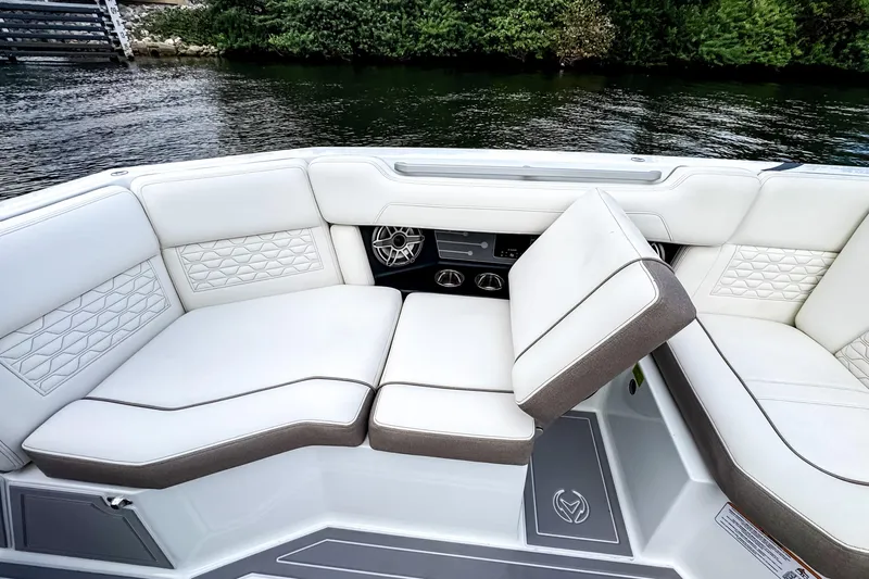  Yacht Photos Pics Luxurious seating on 2026 Ingenity EL boat, featuring elegant white upholstery and modern design.