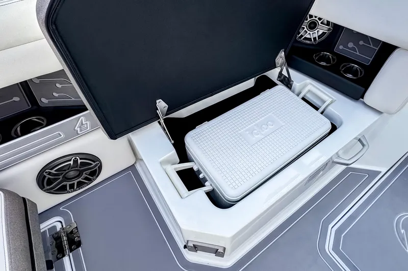  Yacht Photos Pics Ingenity EL 2026 boat interior with storage compartment and cooler.