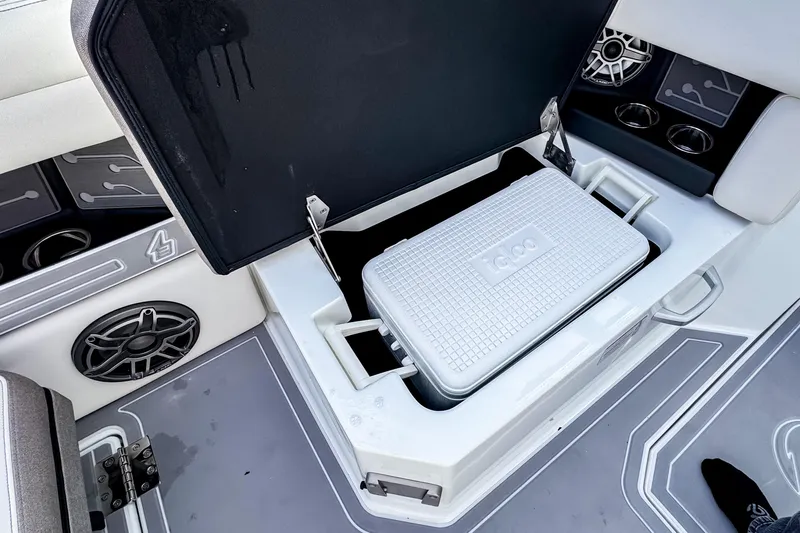  Yacht Photos Pics Open storage compartment on 2026 Ingenity EL boat with cooler inside.