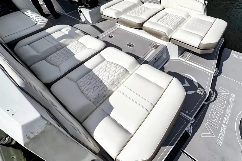  Yacht Photos Pics Luxurious seating on 2026 Ingenity EL boat, featuring Vision Marine Technologies branding.