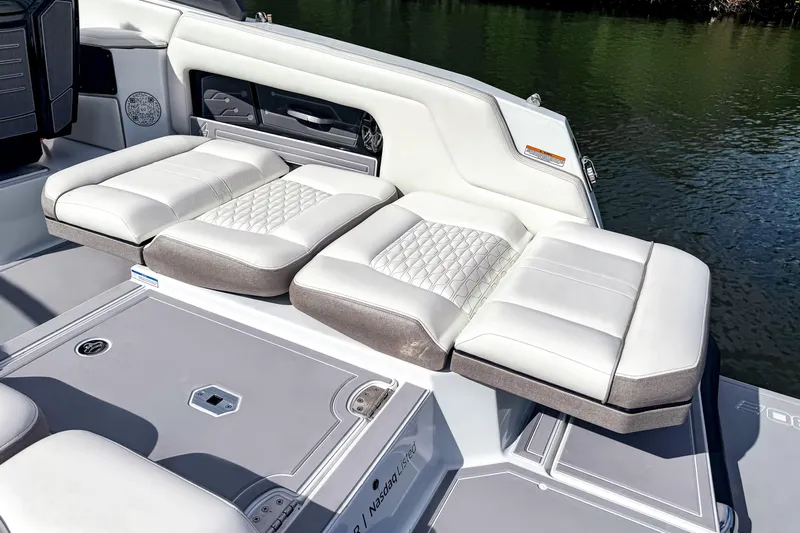  Yacht Photos Pics Luxury seating on 2026 Ingenity EL boat, featuring elegant white and gray upholstery.