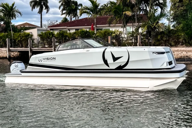  Yacht Photos Pics 2026 Ingenity EL electric boat on water, featuring sleek design and Vision Marine Technologies branding.