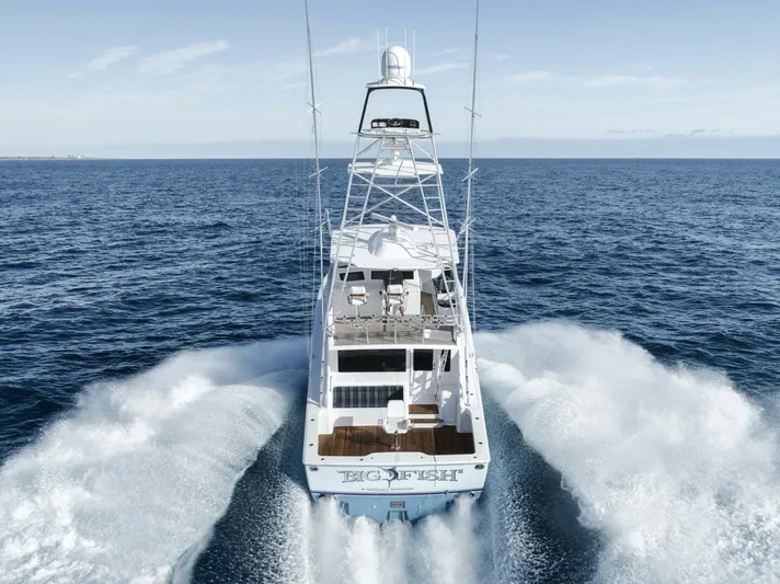 Big Fish II Yacht Photos Pics 2005 Viking Convertible yacht cruising swiftly on open ocean waters.