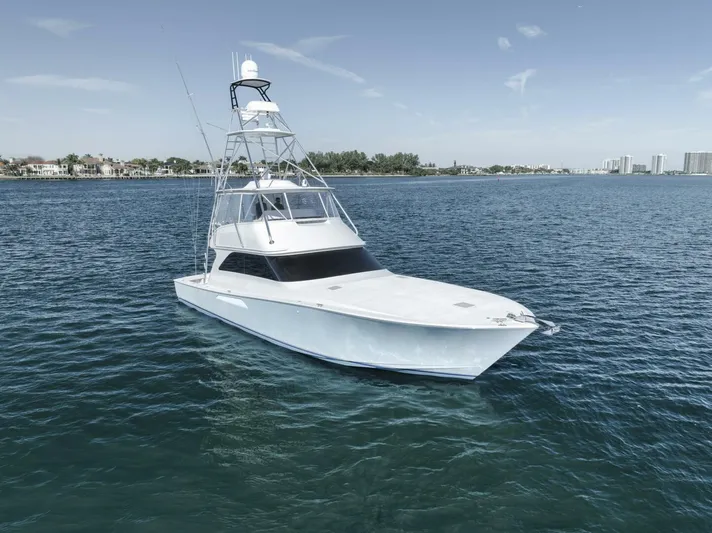 Big Fish II Yacht Photos Pics 2005 Viking Convertible yacht cruising on calm blue waters.