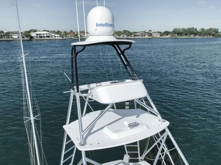 Big Fish II Yacht Photos Pics 2005 Viking Convertible boat with radar tower on calm water.