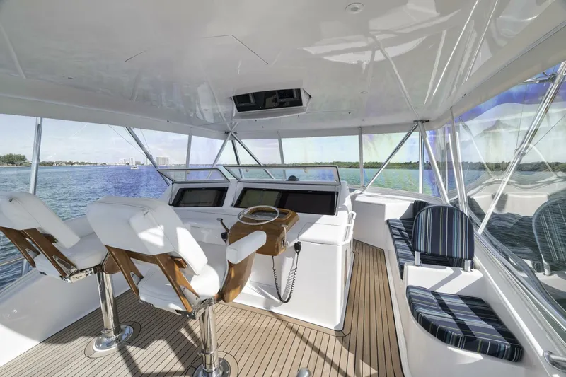 Big Fish II Yacht Photos Pics Luxurious 2005 Viking Convertible yacht interior with helm, seating, and panoramic views.