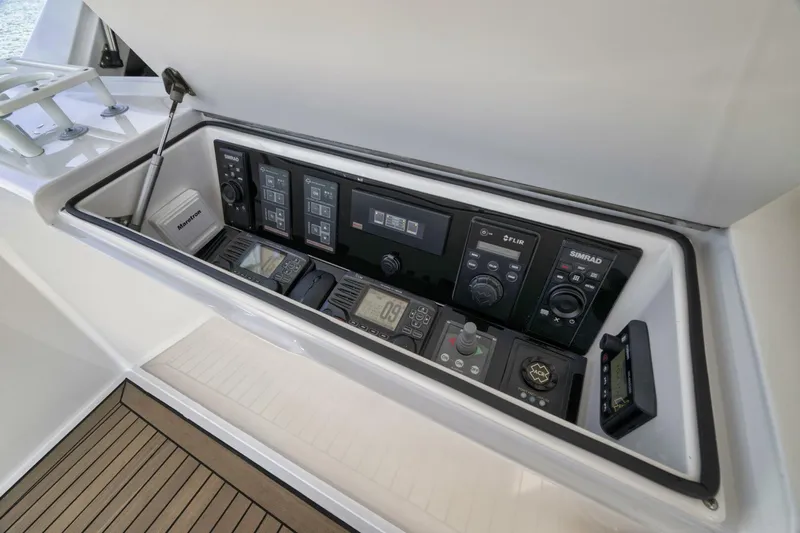 Big Fish II Yacht Photos Pics 2005 Viking Convertible yacht control panel with navigation instruments and communication devices.