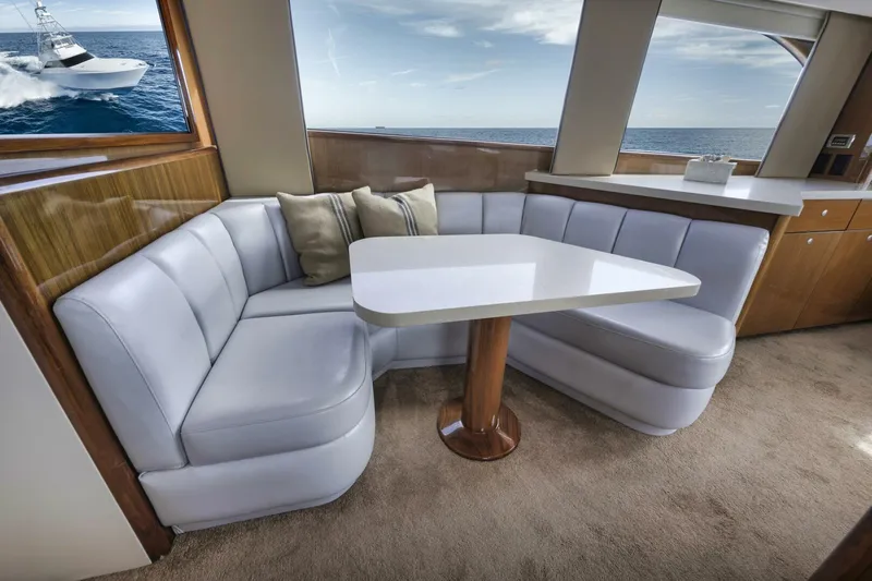 Big Fish II Yacht Photos Pics Luxurious 2005 Viking Convertible yacht interior with plush seating and ocean view.