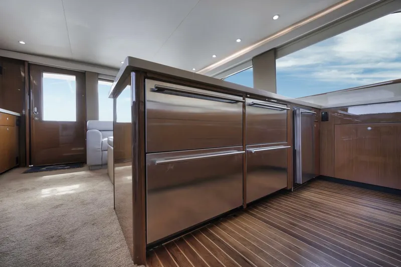 Big Fish II Yacht Photos Pics Luxurious interior of a 2005 Viking Convertible yacht with modern kitchen and ocean view.