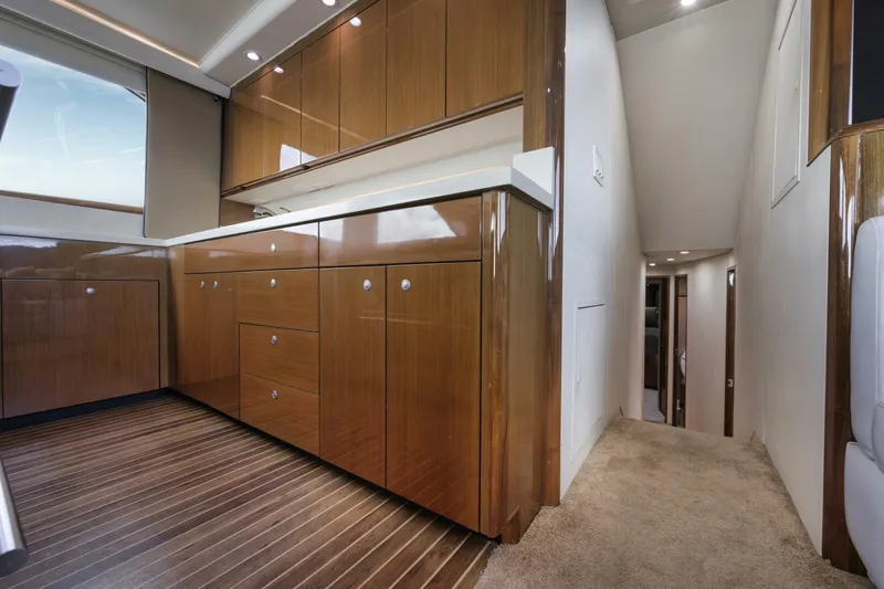 Big Fish II Yacht Photos Pics Luxurious interior of a 2005 Viking Convertible yacht with sleek wooden cabinetry.