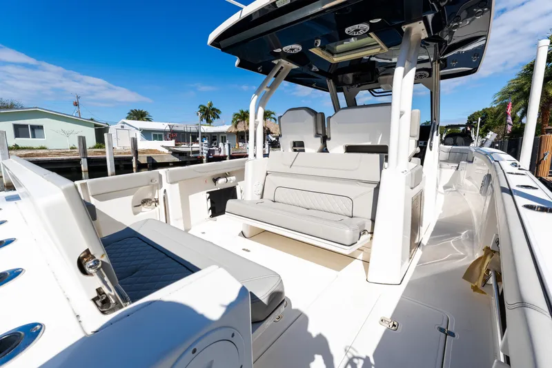  Yacht Photos Pics 2023 Pursuit S 328 Sport boat interior with sleek seating and modern design.