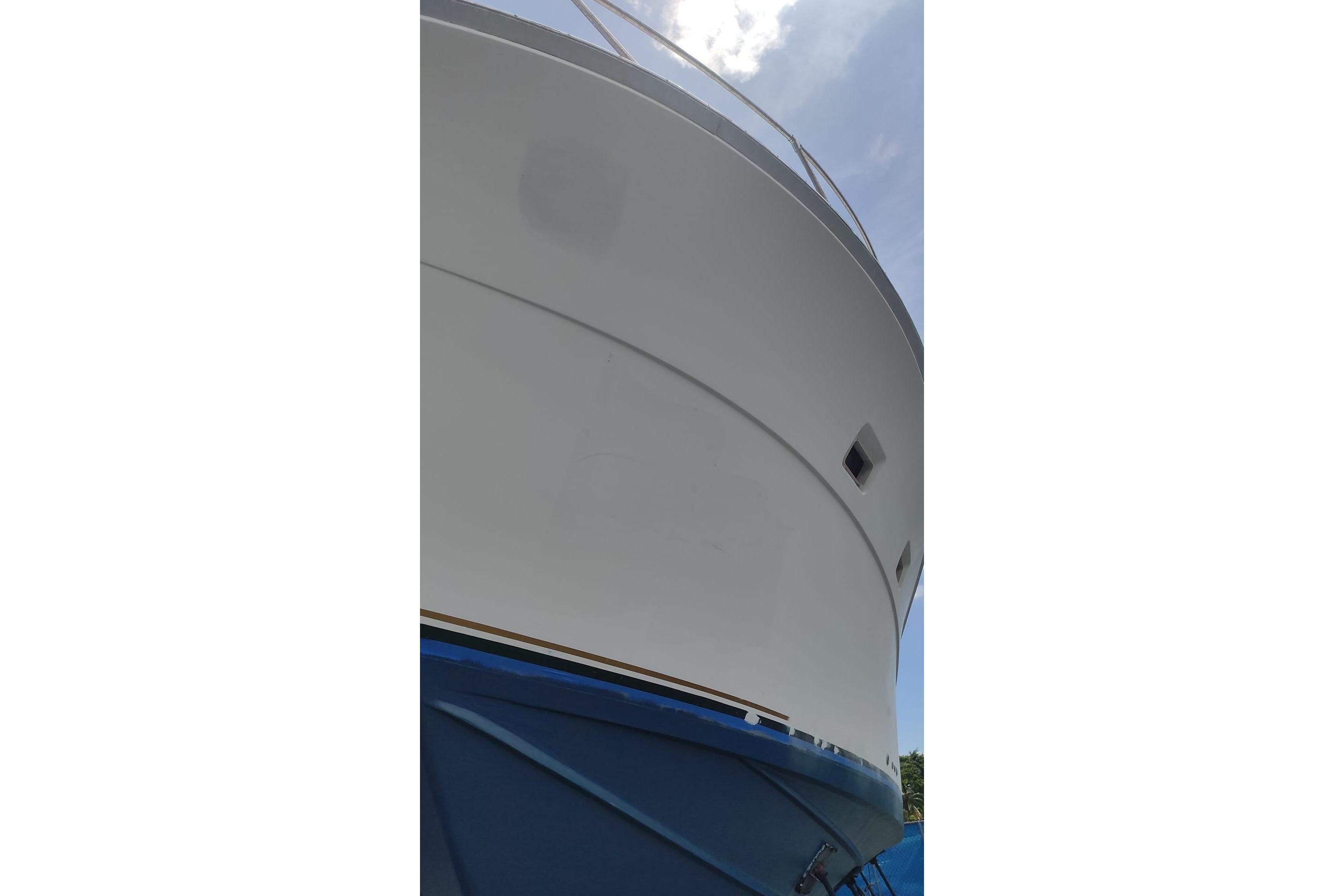 1977 Bertram 46 Convertible yacht, close-up view of hull and bow.