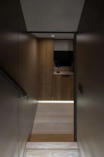 Full Moon Yacht Photos Pics Interior hallway of 2024 Moon 60 Sail yacht with modern wood paneling.