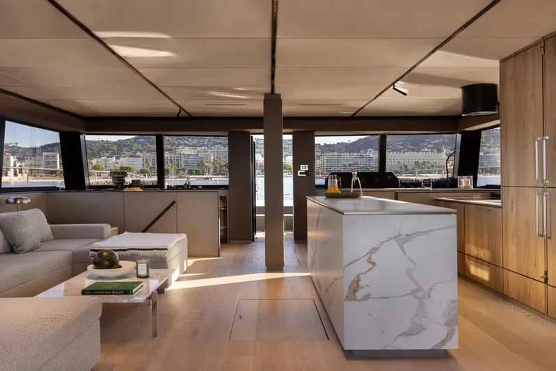 Full Moon Yacht Photos Pics Luxurious interior of 2024 Moon 60 Sail yacht with modern kitchen and panoramic windows.