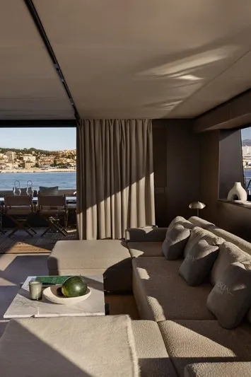 Full Moon Yacht Photos Pics Luxurious interior of 2024 Moon 60 Sail yacht with elegant seating and sea view.