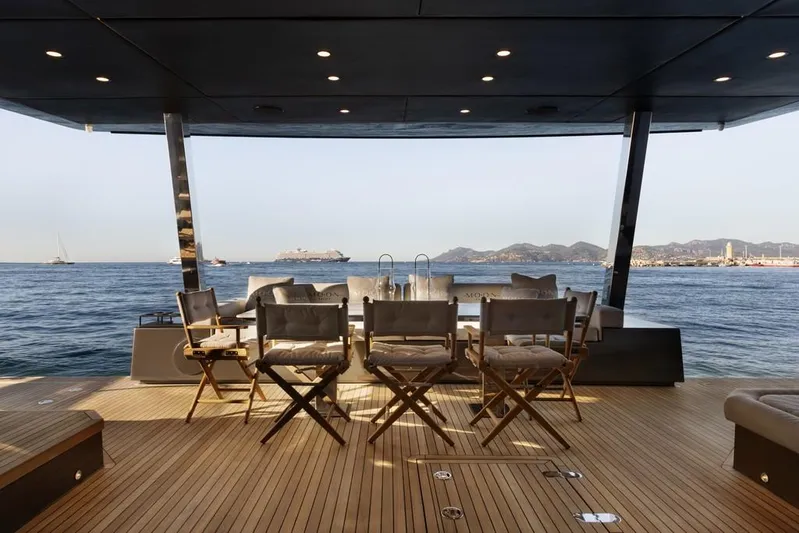 Full Moon Yacht Photos Pics Luxury deck view on 2024 Moon 60 Sail yacht, featuring elegant seating and ocean backdrop.
