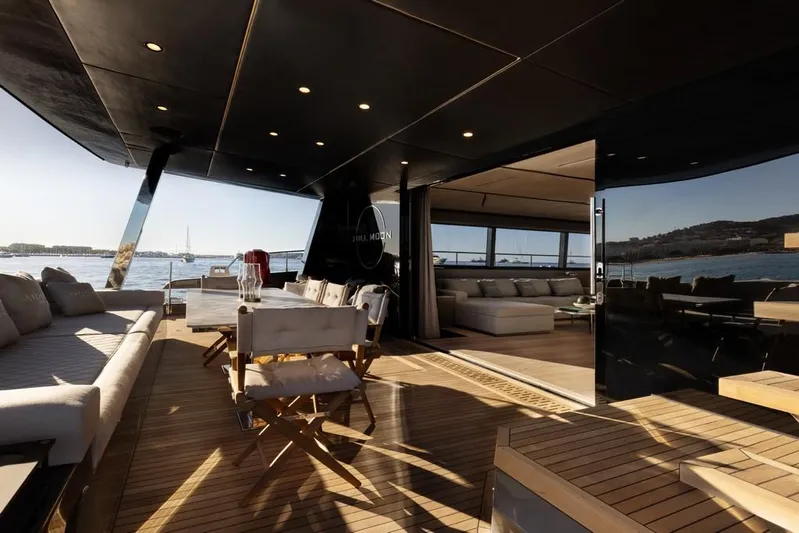 Full Moon Yacht Photos Pics Luxurious 2024 Moon 60 Sail yacht interior with elegant seating and ocean view.