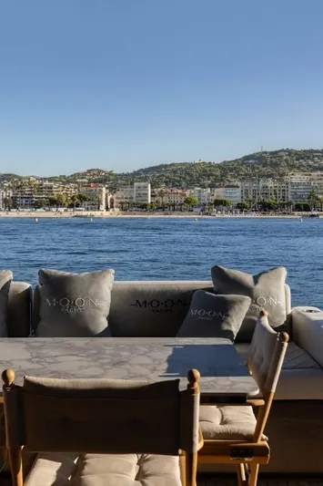 Full Moon Yacht Photos Pics Luxury yacht Moon 60 Sail 2024 with scenic coastal view.