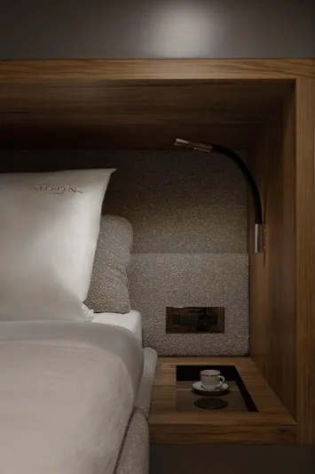 Full Moon Yacht Photos Pics Luxurious cabin interior of 2024 Moon 60 Sail yacht with cozy bed and elegant lighting.