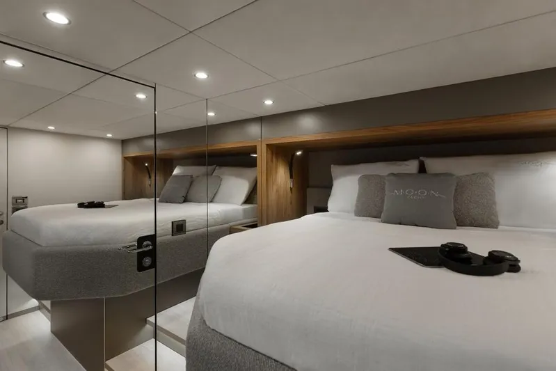 Full Moon Yacht Photos Pics Luxurious bedroom interior of 2024 Moon 60 Sail yacht with modern design and cozy bedding.