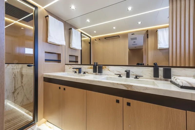  Yacht Photos Pics Luxurious bathroom interior of 2024 Otam 90 GTS yacht with marble countertops and modern fixtures.