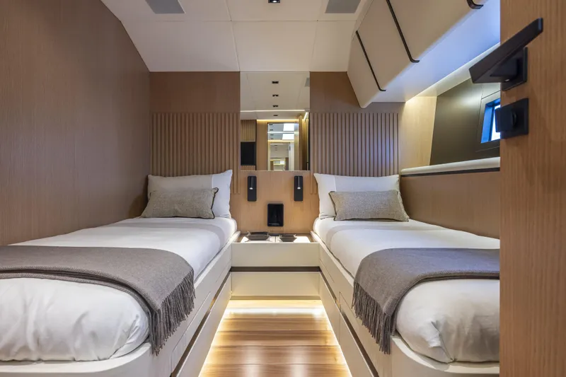  Yacht Photos Pics Luxurious twin cabin interior of 2024 Otam 90 GTS yacht, featuring modern design and ambient lighting.