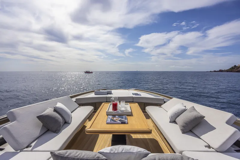  Yacht Photos Pics Luxurious 2024 Otam 90 GTS yacht deck with elegant seating and ocean view.
