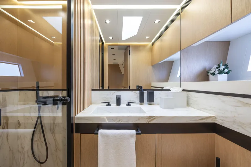  Yacht Photos Pics Luxurious bathroom interior of 2024 Otam 90 GTS yacht with modern fixtures and elegant design.