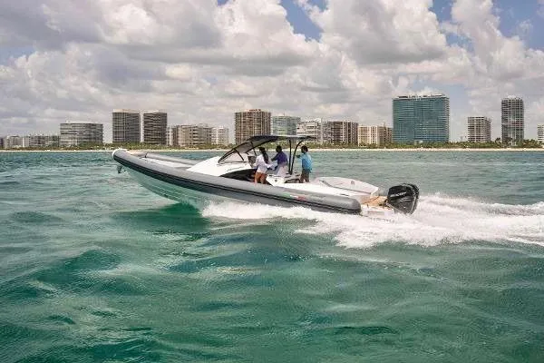  Yacht Photos Pics 2025 Panamera Yacht PY 100 cruising on the ocean near a city skyline.