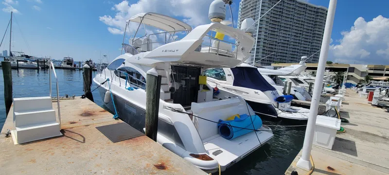  Yacht Photos Pics 2013 Azimut 45 Flybridge yacht docked at a marina on a sunny day.