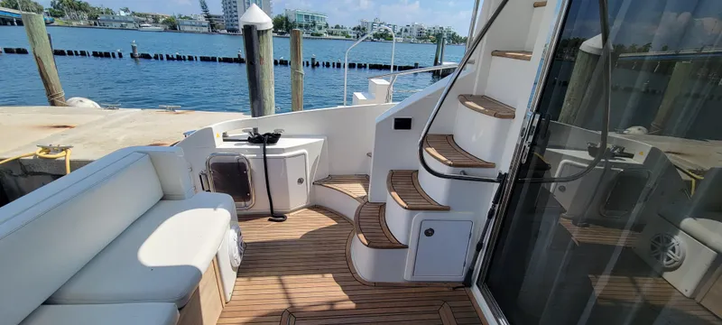  Yacht Photos Pics Azimut 45 Flybridge 2013 yacht deck with seating and stairs, docked at marina.